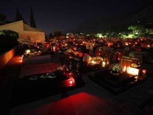 A graveyard on All Saints night.